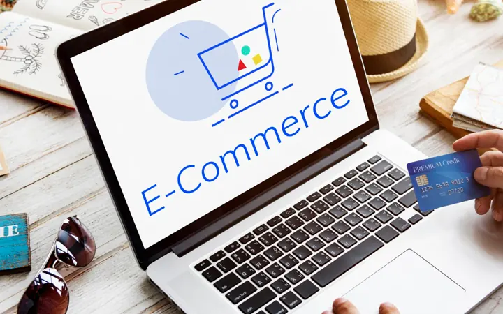Laptop showing an online shop with a customer paying by card